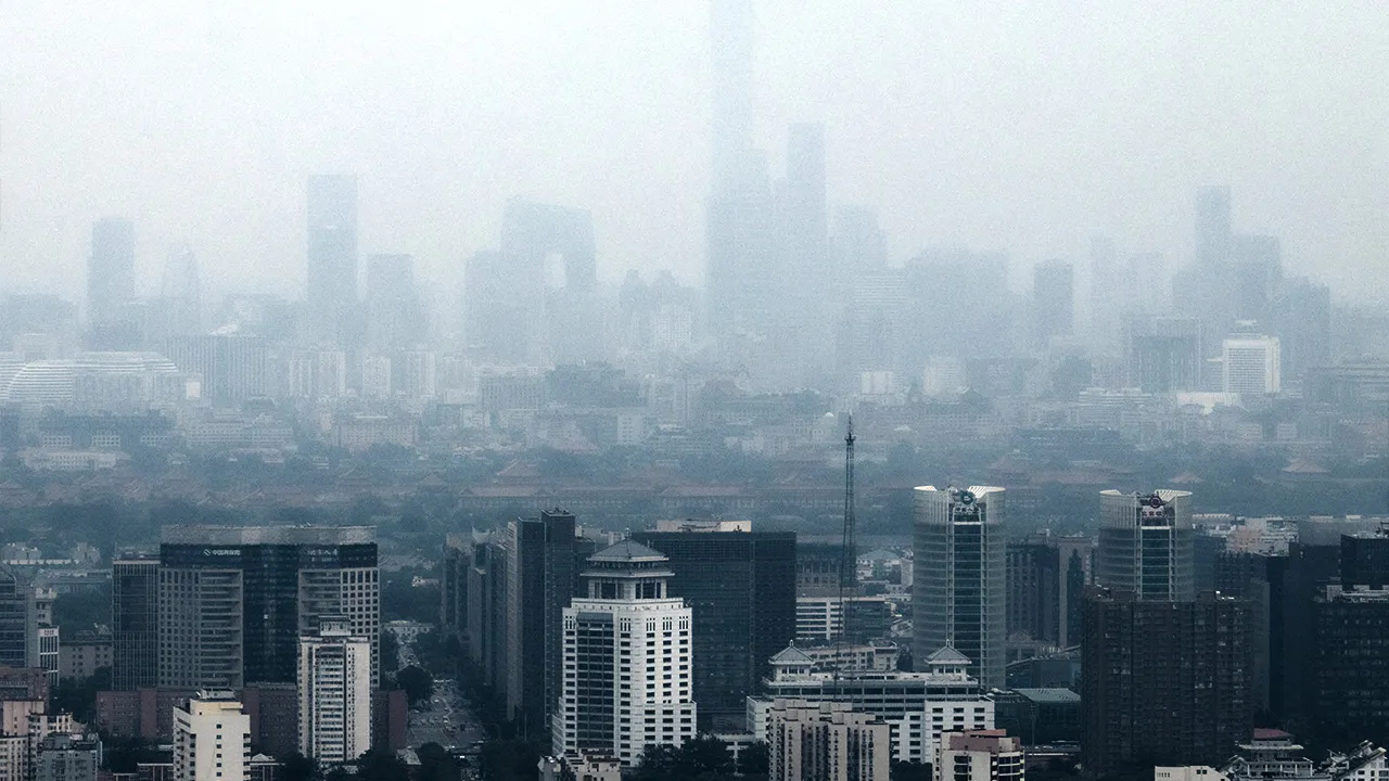 Skyscrapers in Beijing's Central Business District (CBD) and the Forbidden City are seen through haze in Beijing, China, July 24, 2026. REUTERS/Maxim Shemetov