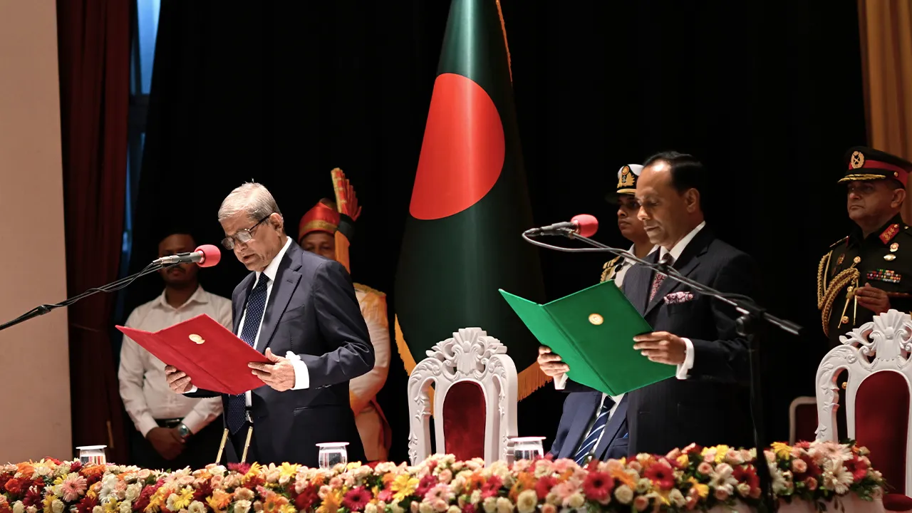 Mirza Fakhrul Islam Alamgir, left, a veteran of the ruling Bangladesh Nationalist Party, takes the oath of office as president of the country in Dhaka, Bangladesh, Friday, Aug. 21, 2026. (AP Photo/Mahmud Hossain Opu)