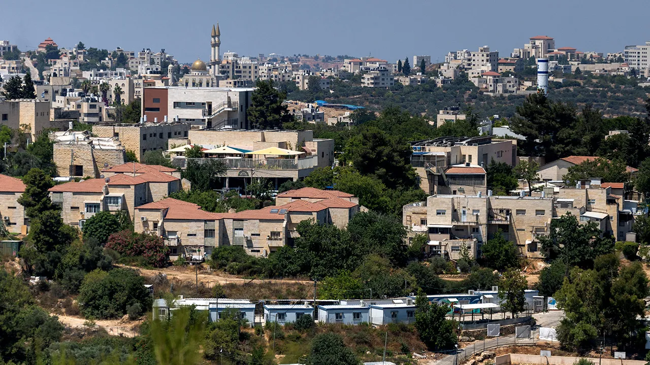 A general view of the Israeli settlement of Beit El in the Israeli-occupied West Bank. The Palestinian town Surda, near Ramallah, can be seen in the background. July 22, 2026. REUTERS/Ronen Zvulun