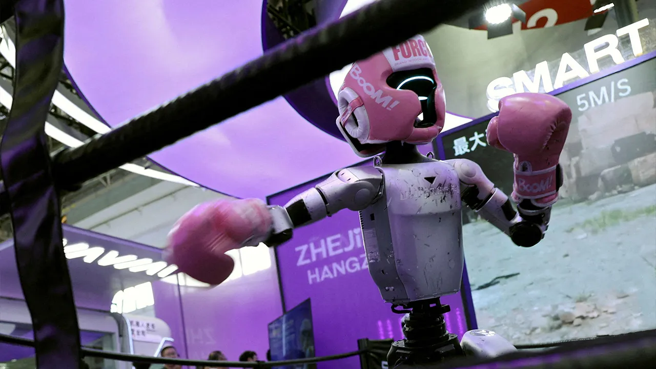 A Unitree humanoid robot demonstrates kickboxing moves at the booth on Zhejiang province during the China International Supply Chain Expo (CISCE) in Beijing, China June 22, 2026. REUTERS/Florence Lo/File Photo