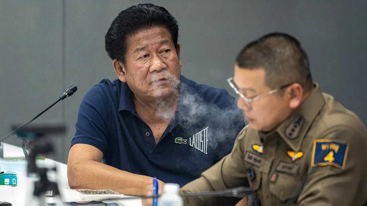 Former lawmaker Chalong Riewrang reacts as he is questioned by police officers after he allegedly shot and killed Thongchai Yenprasert, president of the Nonthaburi Provincial Administrative Organisation, in Nonthaburi province, on the outskirts of Bangkok, Thailand, August 10, 2026. REUTERS/Arnun Chonmahatrakool TPX IMAGES OF THE DAY