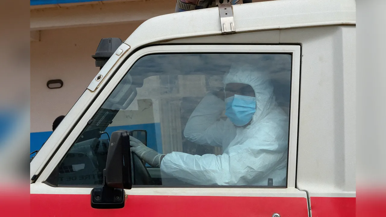 FILE PHOTO: A doctor wearing personal protective equipment (PPE) sits in an ambulance at the Ebola Virus Disease Treatment Center at the Bunia General Reference Hospital, one month after cases were confirmed in Bunia, eastern Democratic Republic of Congo, June 15, 2026. REUTERS/Gradel Muyisa Mumbere/File Photo