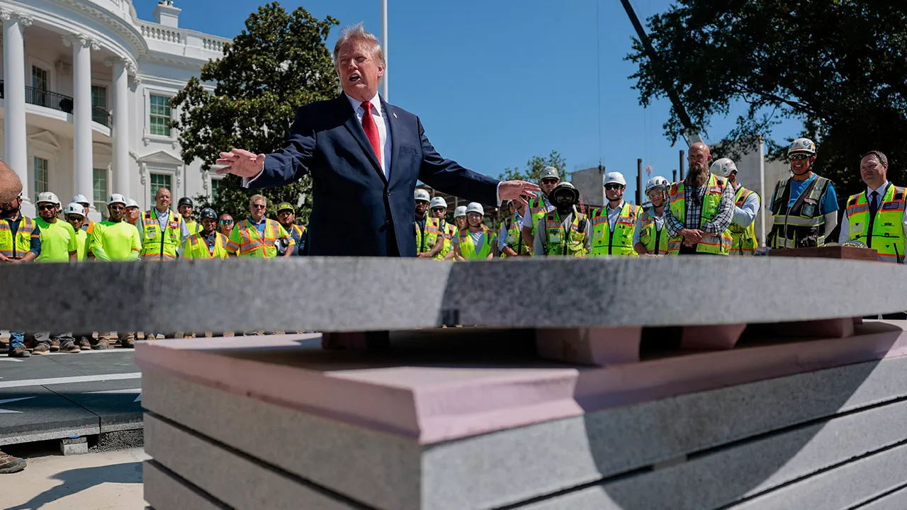 U.S. President Donald Trump speaks about the helipad being constructed on the South Lawn, at the White House in Washington, D.C., U.S., August 19, 2026. REUTERS/Kylie Cooper