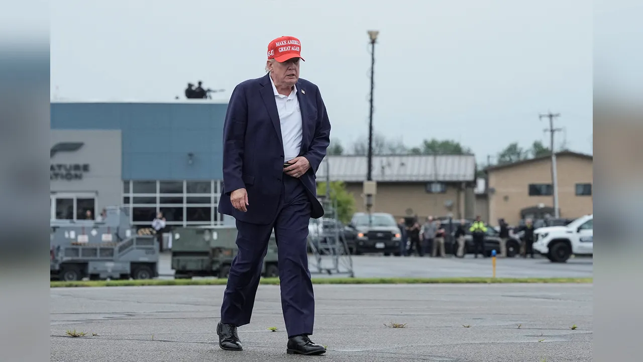 U.S. President Donald Trump walks to board Air Force One en route to Joint Base Andrews, Maryland, at Morristown Municipal Airport in Morristown, New Jersey, U.S., August 16, 2026. REUTERS/Ken Cedeno