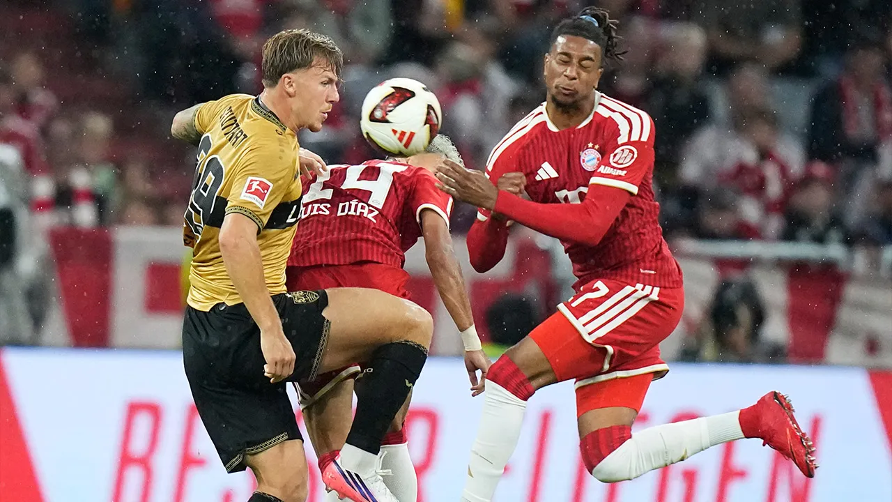 Stuttgart's Finn Jeltsch, left, challenges for the ball with Bayern's Luis Diaz, centre, and Michael Olise during the Bundesliga soccer match between Bayern Munich and VfB Stuttgart in Munich, Germany, Friday, Aug. 28, 2026. (AP Photo/Matthias Schrader)