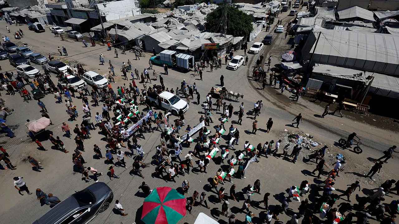 Palestinians attend the funeral of 50 people from three families killed during the war and whose bodies were retrieved from under the rubble recently, in Gaza City, August 20, 2026. REUTERS/Mahmoud Issa