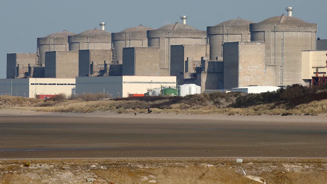 The Gravelines nuclear power plant is seen across the beach in Petit Fort Philippe, northern France, March 10, 2017. REUTERS/Pascal Rossignol
