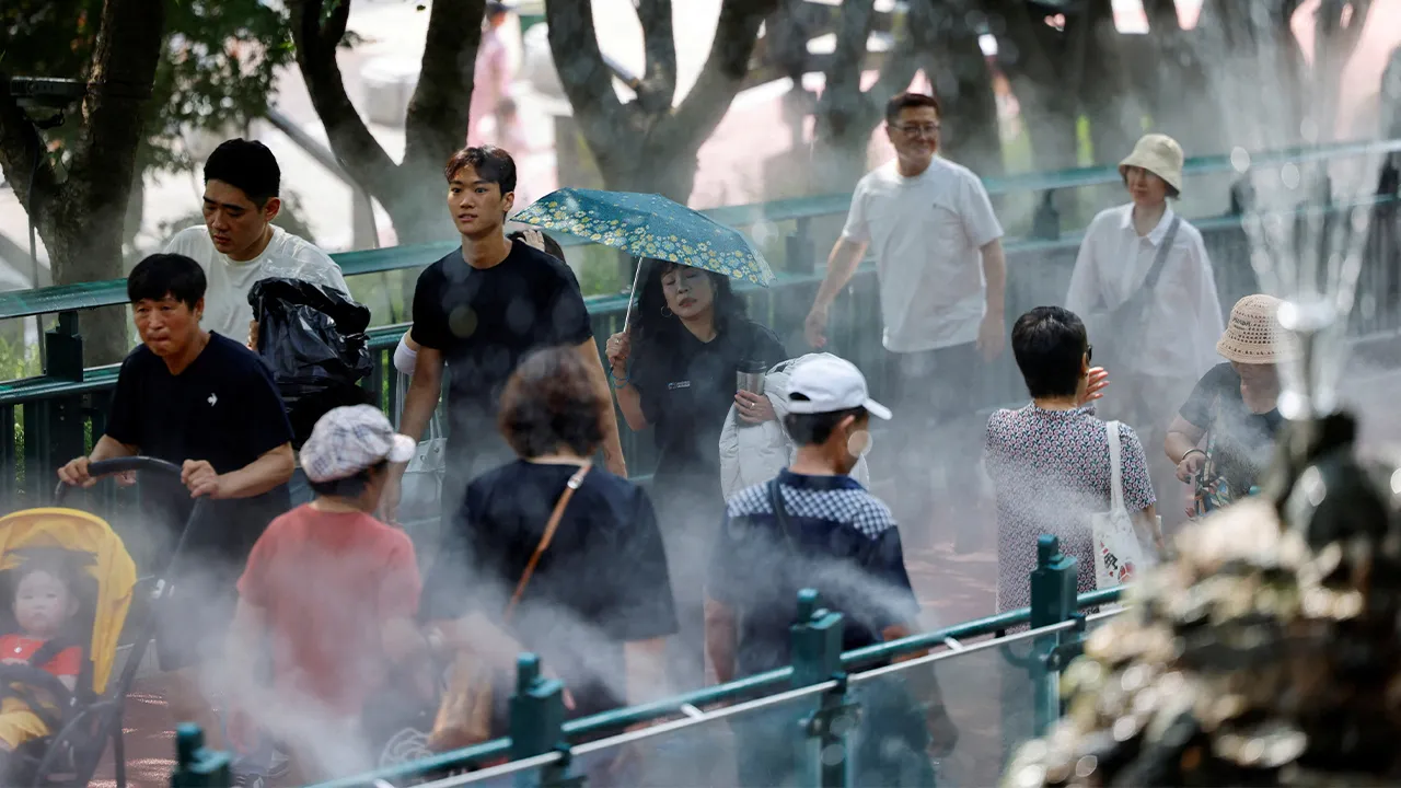 Visitors walk through a cooling mist system at Gwangmyeong Cave during a record-breaking heatwave in Gwangmyeong, South Korea, August 5, 2026, after Yangsan recorded the highest temperature in the country in 122 years of weather observations on Sunday. REUTERS/Kim Soo-hyeon TPX IMAGES OF THE DAY