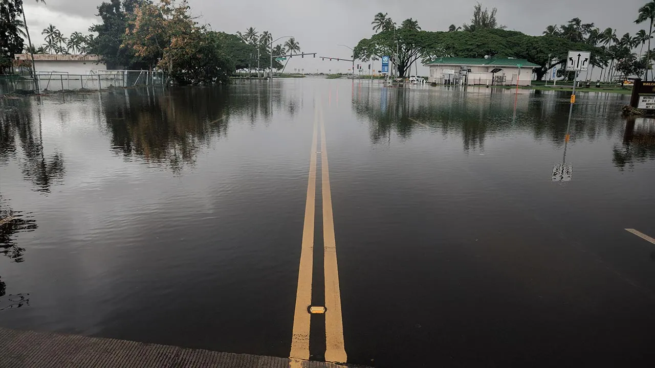 A road is flooded due to Hurricane Lala in Hilo, Hawaii, Sunday, Aug. 16, 2026. (Stephen Lam/San Francisco Chronicle via AP)