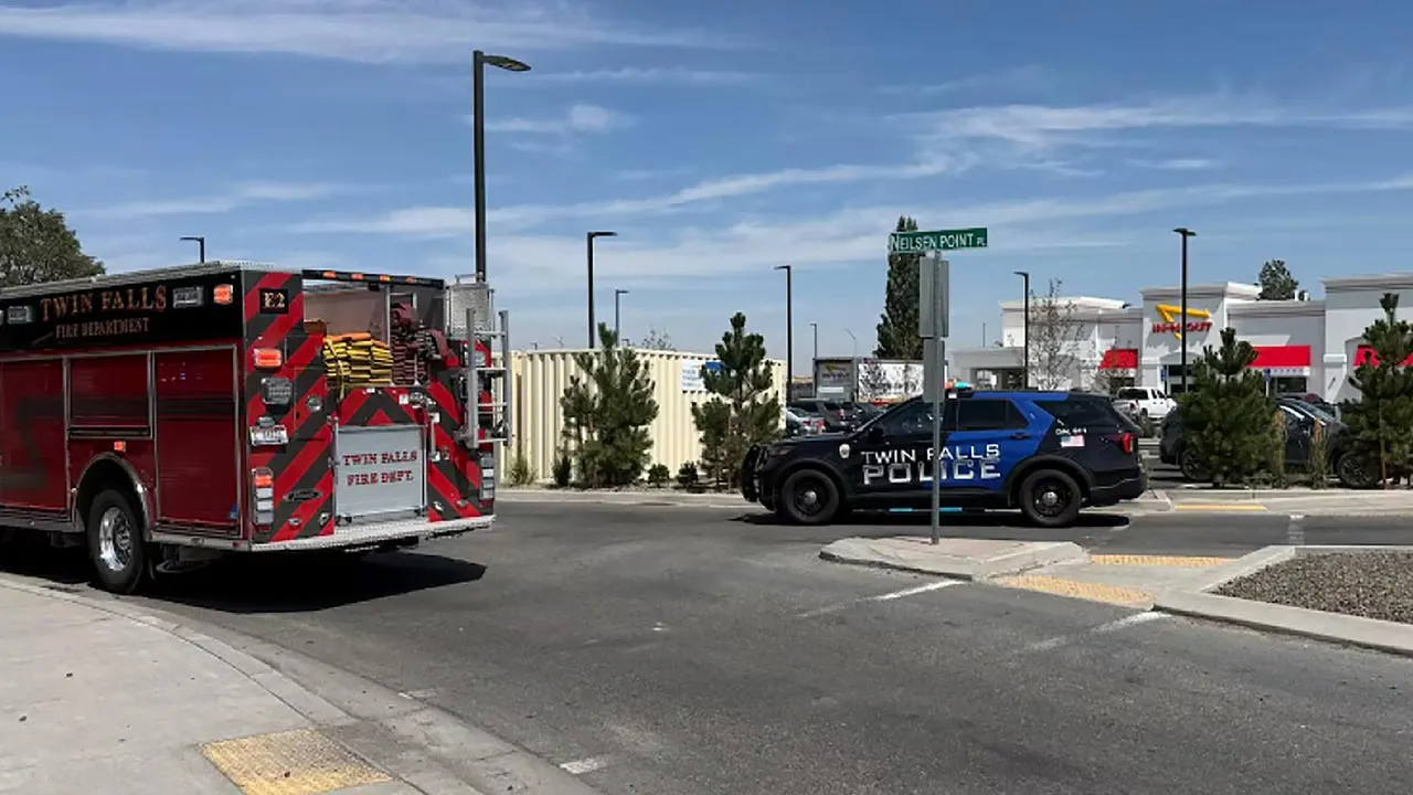 This image provided by KMVT shows the scene of a shooting that started at an In-N-Out Burger restaurant, Saturday, Aug. 1, 2026 in Twin Falls, Idaho. (KMVT via AP)