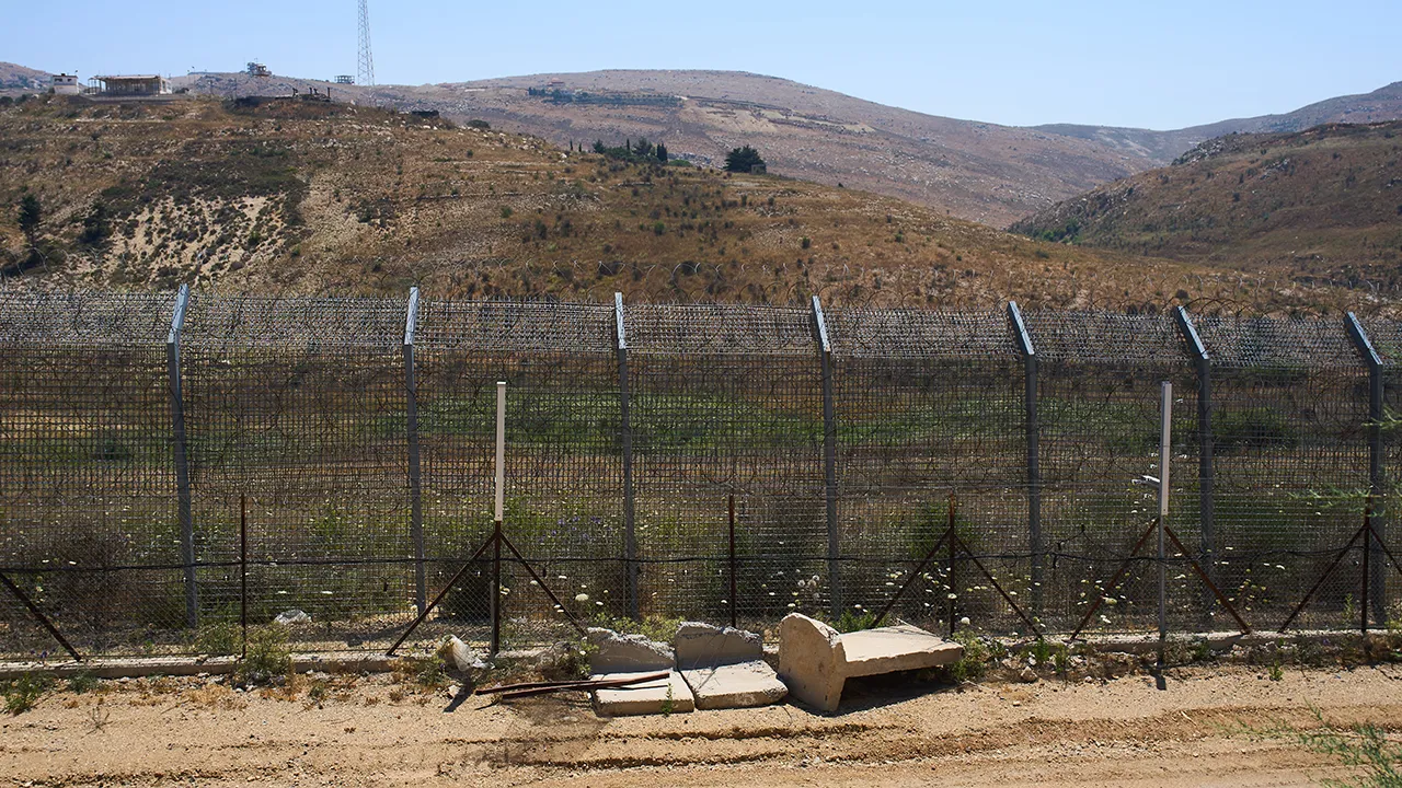 The border between Syria and the Israeli-controlled Golan Heights town of Majdal Shams is seen Tuesday, July 21, 2026. (AP Photo/Ariel Schalit)