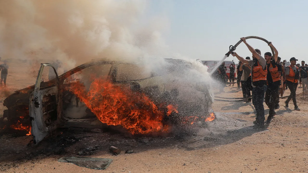 Civil defence firefighters attempt to extinguish a fire following an Israeli air strike that hit a vehicle and killed a senior police official, in Gaza City, August 13, 2026. REUTERS/Stringer TPX IMAGES OF THE DAY