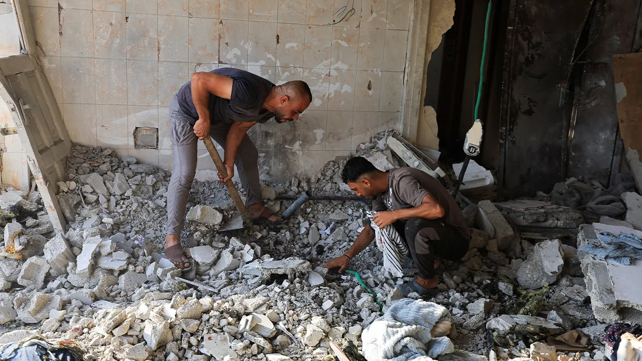 Palestinians inspect the site of an Israeli strike on a residential apartment, according to medics, in Gaza City, August 2, 2026. REUTERS/Dawoud Abu Alkas