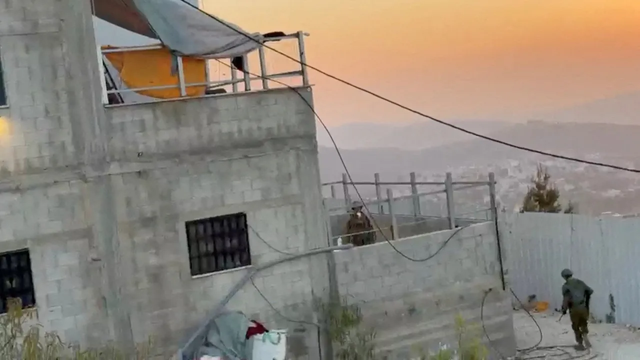 Israeli soldiers at a besieged house in Qusra, in the Israeli-occupied West Bank, August 20, 2026, in this screengrab taken from a video obtained by Reuters via REUTERS