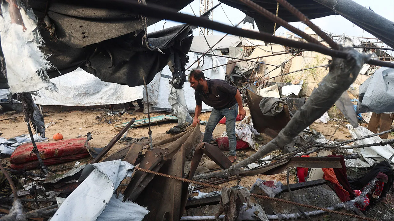 A Palestinian man inspects the site of an Israeli strike on a tent in Khan Younis, in the southern Gaza Strip, July 30, 2026. REUTERS/Ramadan Abed