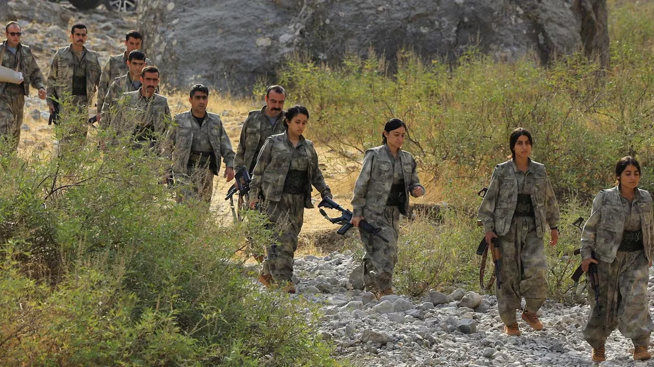 Fighters with the Kurdistan Workers' Party (PKK) walk for a disarmament ceremony marking a significant step toward ending the decades-long conflict between Turkey and the outlawed group, in the Qandil mountains, Iraq October 26, 2025. REUTERS/Thaier Al-Sudani 