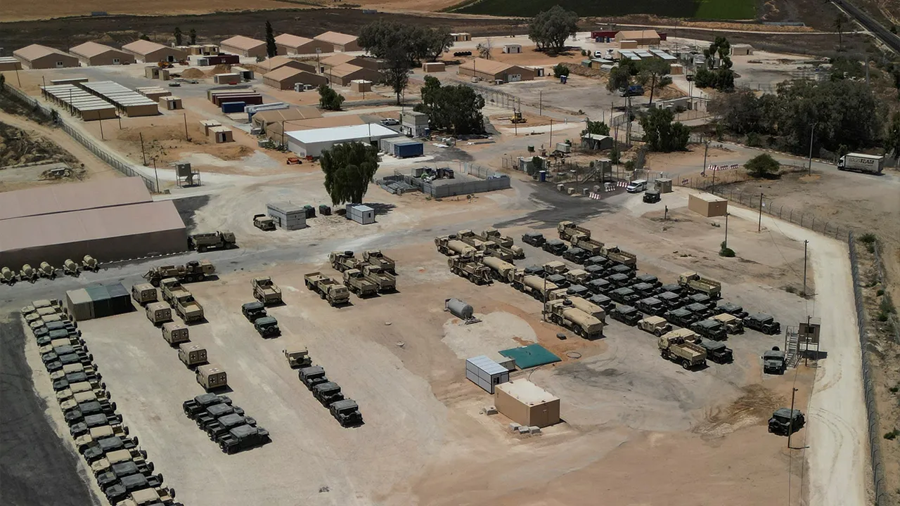 A drone view of military vehicles at LSA Endurance, a logistical support and staging facility designed to support the International Stabilization Force (ISF) under the direction of the Board of Peace (BoP), near the Israel-Gaza border in the Kerem Shalom area, southern Israel, August 10, 2026. REUTERS/Amir Cohen