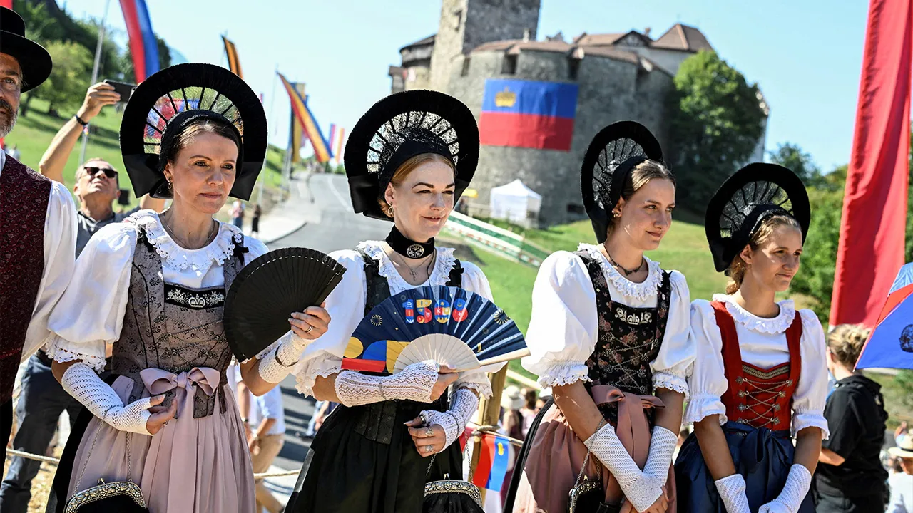 Women wear traditional dress during Liechtenstein's National Day celebrations in Vaduz, Liechtenstein, August 15, 2026. REUTERS