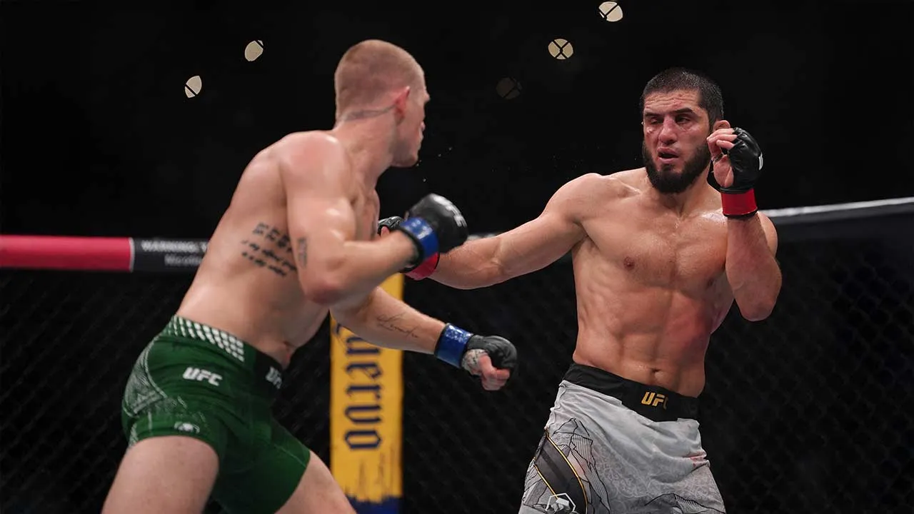 Aug 15, 2026; Philadelphia, Pennsylvania, USA; Islam Makhachev (red gloves) fights against Iah Machado Garry (blue gloves) in the welterweight title bout during UFC 330 at Xfinity Mobile Arena. Mandatory Credit: Kyle Ross-Imagn Images