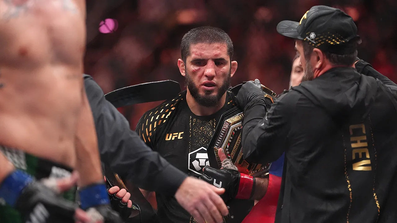 Aug 15, 2026; Philadelphia, Pennsylvania, USA; Islam Makhachev (red gloves) celebrates after defeating Ian Machado Garry (blue gloves) in the welterweight title bout during UFC 330 at Xfinity Mobile Arena. Mandatory Credit: Kyle Ross-Imagn Images