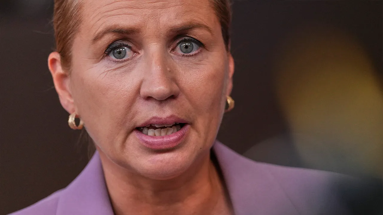 Denmark's Prime Minister Mette Frederiksen talks to journalists as she arrives for the EU summit in Brussels, Thursday, June 18, 2026. (AP Photo/Marius Burgelman, File)