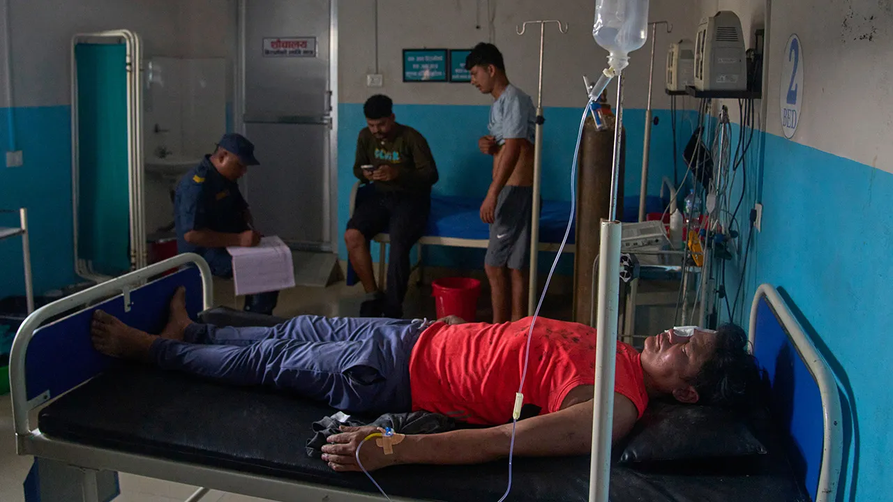 An injured of a flash flooding recovers in a hospital in Nepal's Nuwakot district, Wednesday, Aug. 26, 2026. (AP Photo/Niranjan Shrestha)