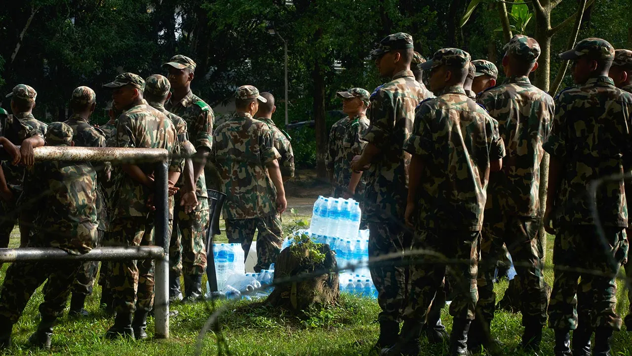 Nepalese army soldiers stand in the aftermath of flash floods in Devighat in the Nuwakot district in Nepal, Thursday, Aug. 27, 2026. (AP Photo/Niranjan Shrestha)