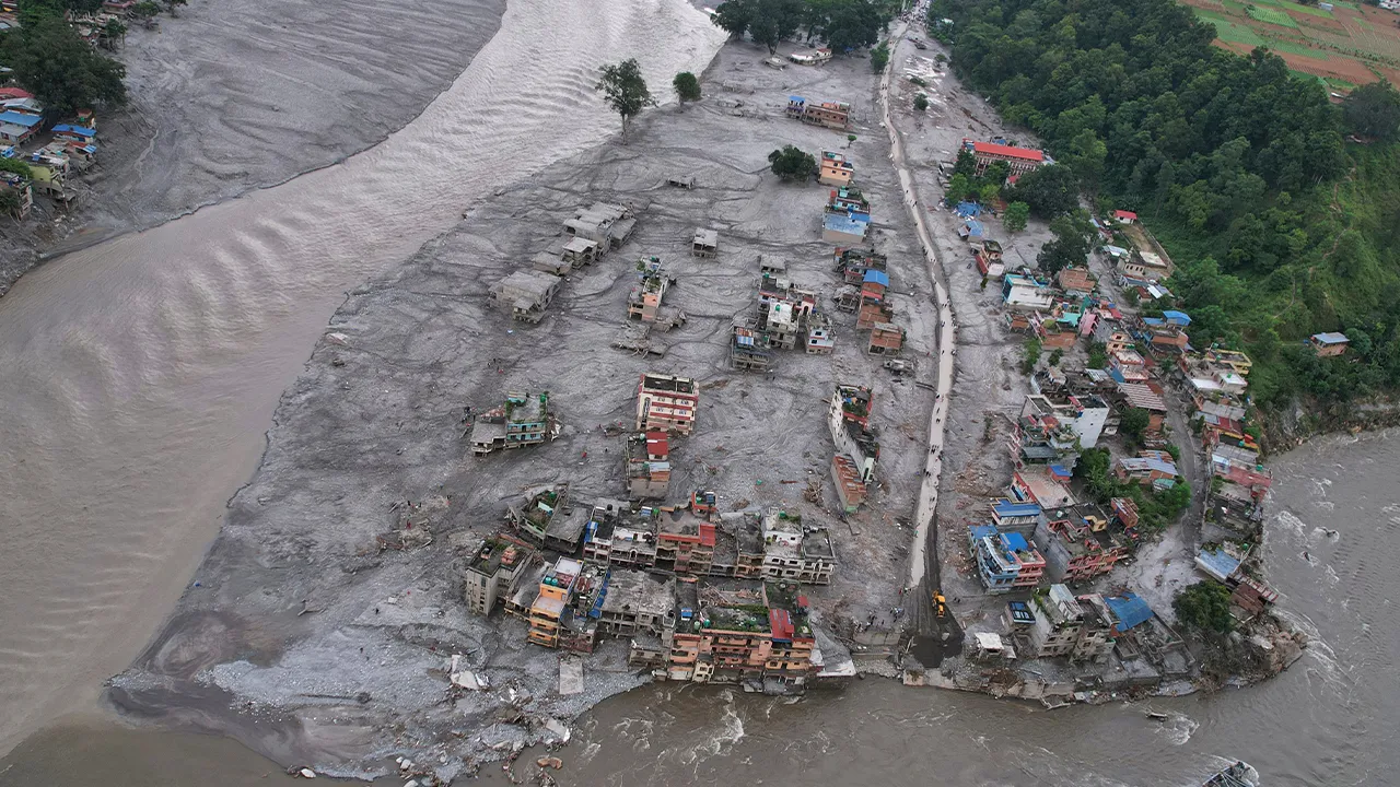 A drone view of the aftermath of flash flooding at the confluence of the Trishuli and Tadi rivers in the Devighat area of Nuwakot district, Nepal, Saturday, Aug. 29, 2026. (AP Photo/Rajesh Kumar Singh)