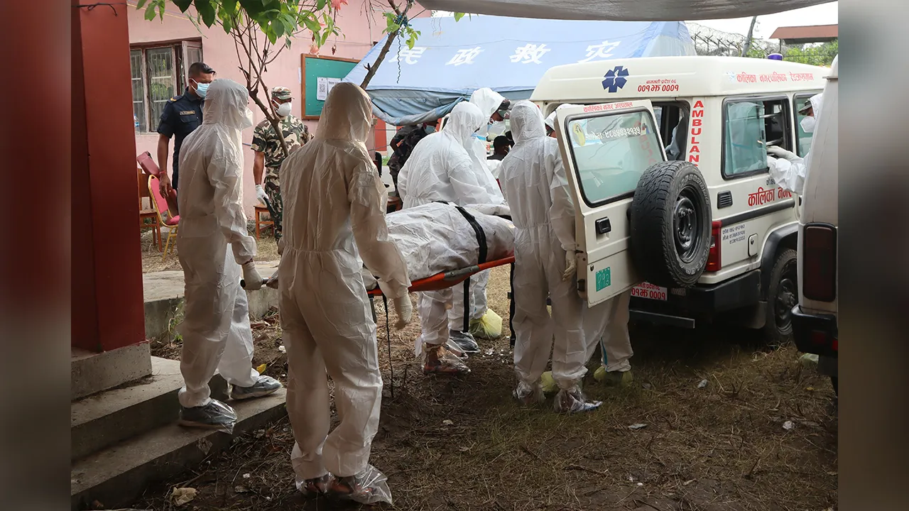 Rescuers carry bodies of flash flood victims for a mass burial in Chitwan, Nepal, Saturday, Aug. 29, 2026. (AP Photo/Nisha Shrestha)