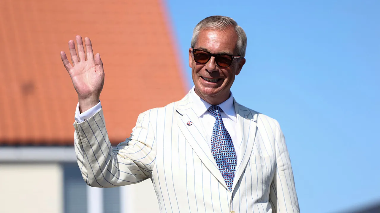 Britain's Reform UK party leader Nigel Farage arrives at his polling station for the Clacton by-election, triggered by his own resignation, in Walton-on-the-Naze, Essex, Britain, August 13, 2026. REUTERS/Toby Shepheard