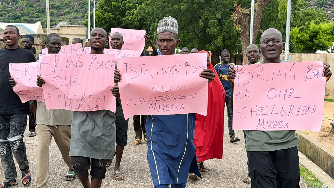 Parents of abducted students hold placards during a protest calling for the release of their children, as students remain in the custody of their captors in Askira-Uba, Borno State, Nigeria, August 20, 2026. Picture taken with a mobile phone. REUTERS/Umaru Kirawa