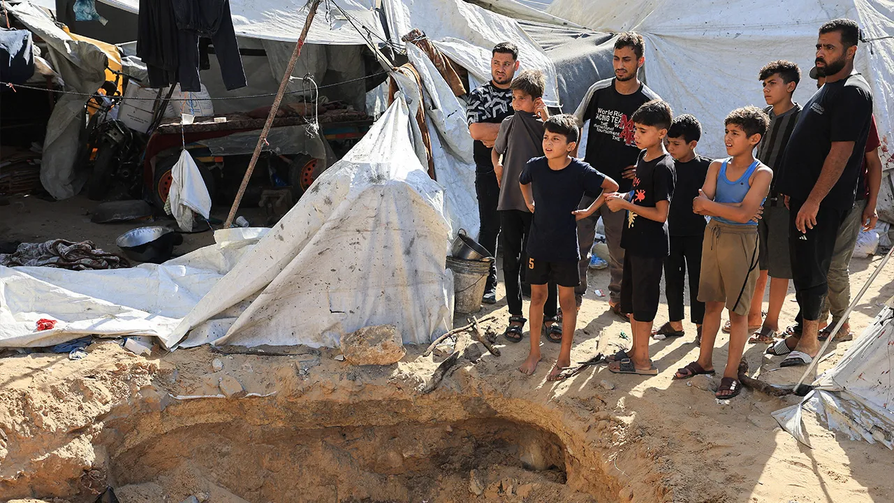 Palestinians inspect the site of an Israeli strike on a tent, according to medics, in Gaza City, August 2, 2026. REUTERS