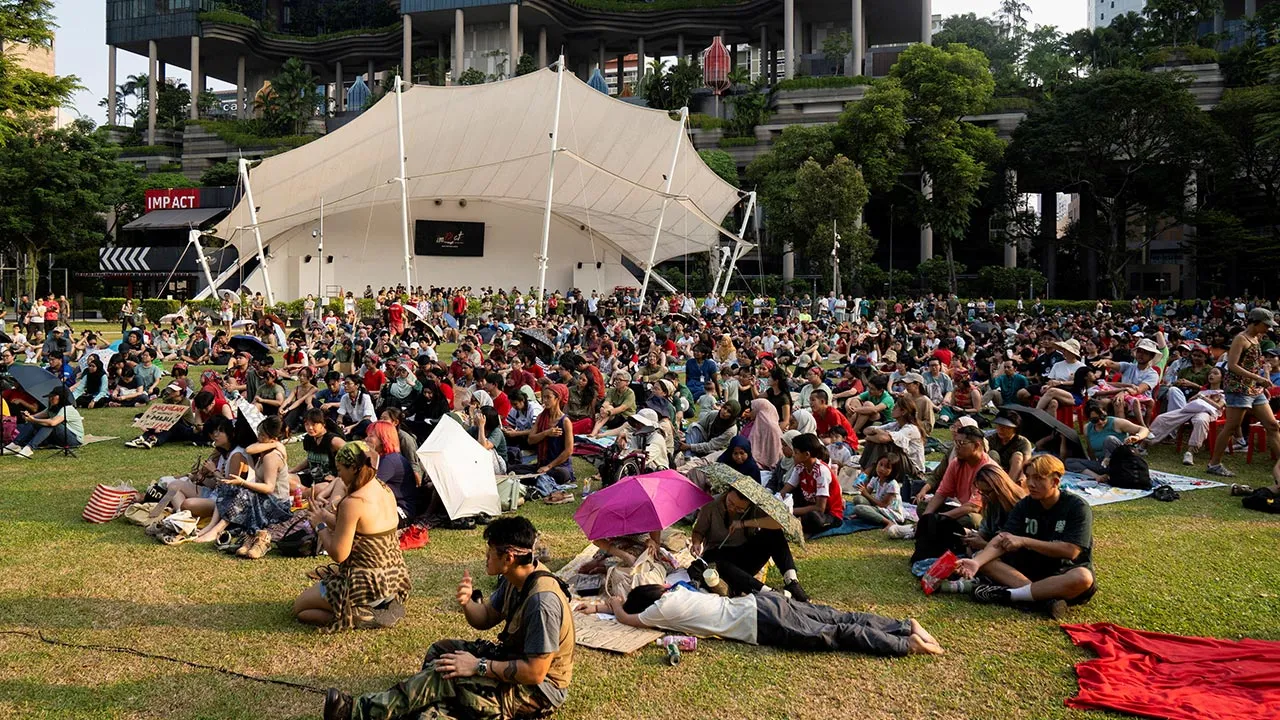 People rally in support of Maju Forest, a secondary forest where authorities have proposed a public housing development that would partially redevelop the site, at Hong Lim Park in Singapore, August 16, 2026. REUTERS/Ore Huiying/File Photo