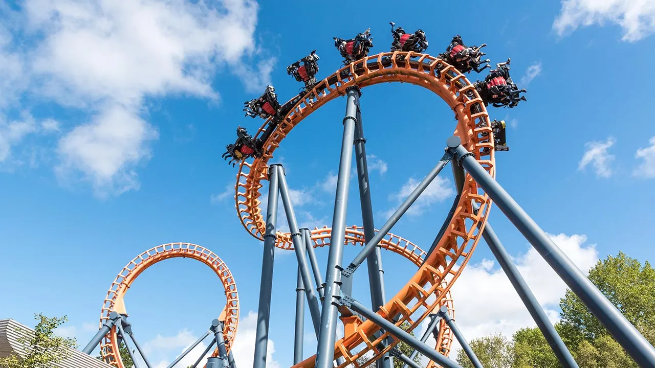 Ferris wheel and roller coaster, France -- Adobe Stock