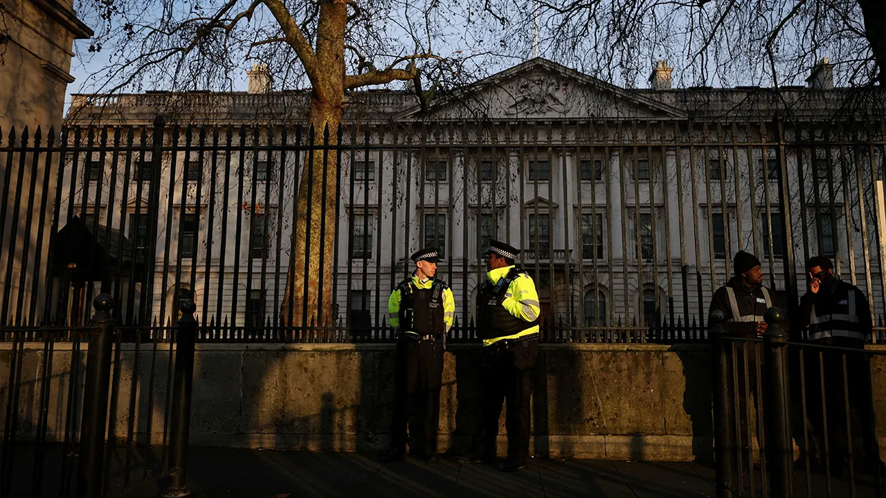 Police officers stand outside the Royal Mint Court, the proposed site of a new Chinese mega embassy at Royal Mint Court, in London, Britain, January 17, 2026. REUTERS/Isabel Infantes