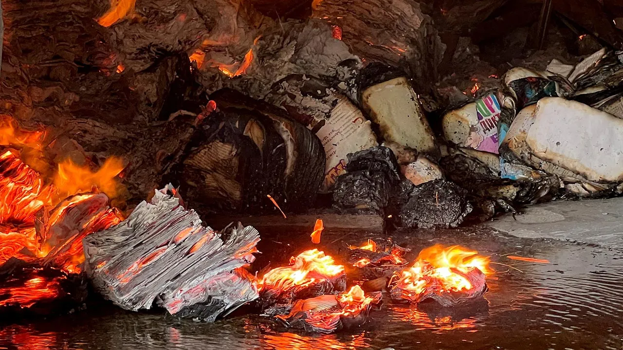 FILE PHOTO: Books burn at the site of a book warehouse hit by a Russian drone strike, amid Russia's attack on Ukraine, in Kharkiv, Ukraine, August 1, 2026. Picture taken with a mobile phone. REUTERS/Volodymyr Pavlov/File Photo