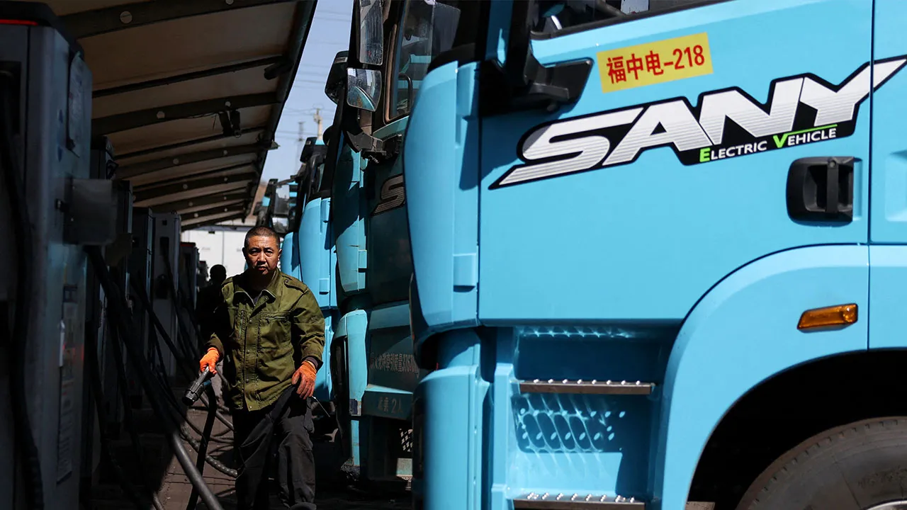 A driver uses a charging station to charge a Sany electric heavy truck at a fleet depot equipped with electric truck charger, in Tangshan, Hebei province, China, April 1, 2026. REUTERS/Tingshu Wang