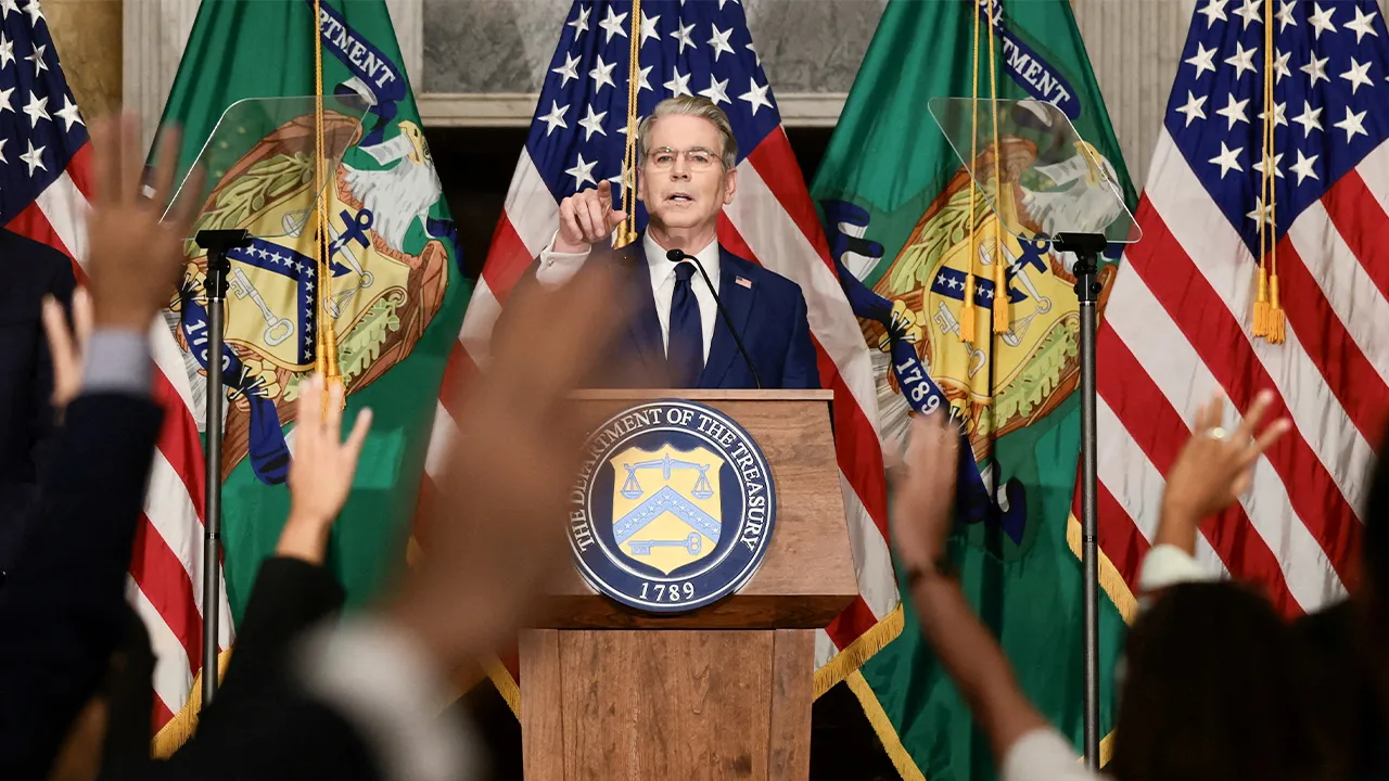 FILE PHOTO: U.S. Treasury Secretary Scott Bessent points as reporters raise their hands during a press conference to outline further sanctions against Iran, at the Treasury Department in Washington, D.C., U.S., August 24, 2026. REUTERS/Evelyn Hockstein/File Photo