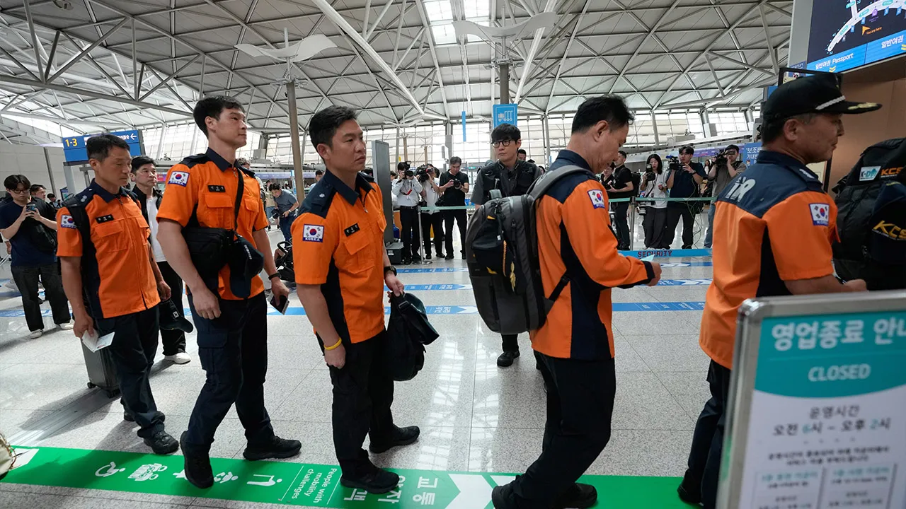 South Korea's Rapid Response Team members prepare to board a plane to Nepal to support search and rescue efforts as South Koreans remain unaccounted for following a massive flooding in Nepal, at the Incheon International Airport in Incheon, South Korea, Thursday, Aug. 27, 2026. (AP Photo/Ahn Young-joon)