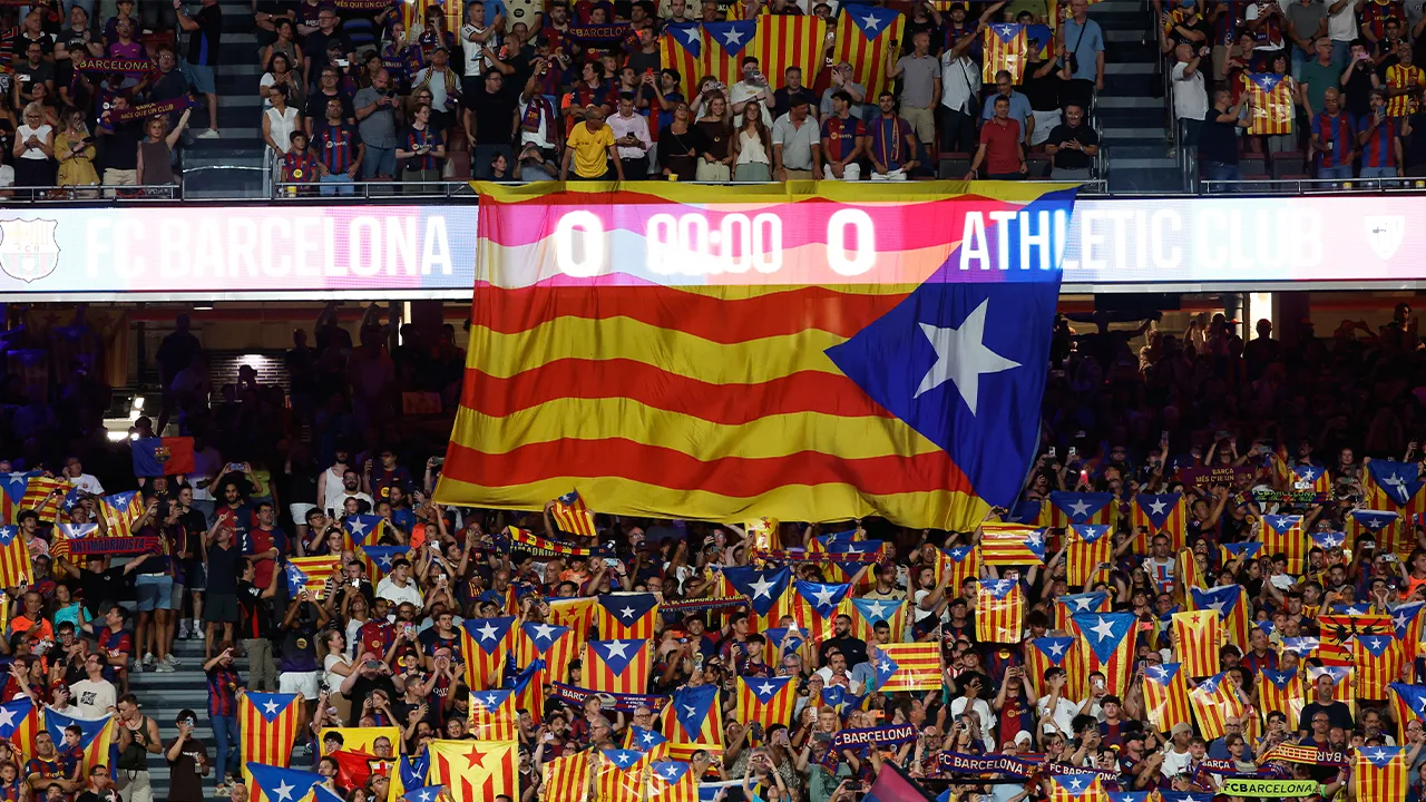 Supporters lift independence flags during a Spanish La Liga soccer match between Barcelona and Athletic in Barcelona, Spain, Thursday, Aug. 27, 2026. (AP Photo/Joan Monfort)