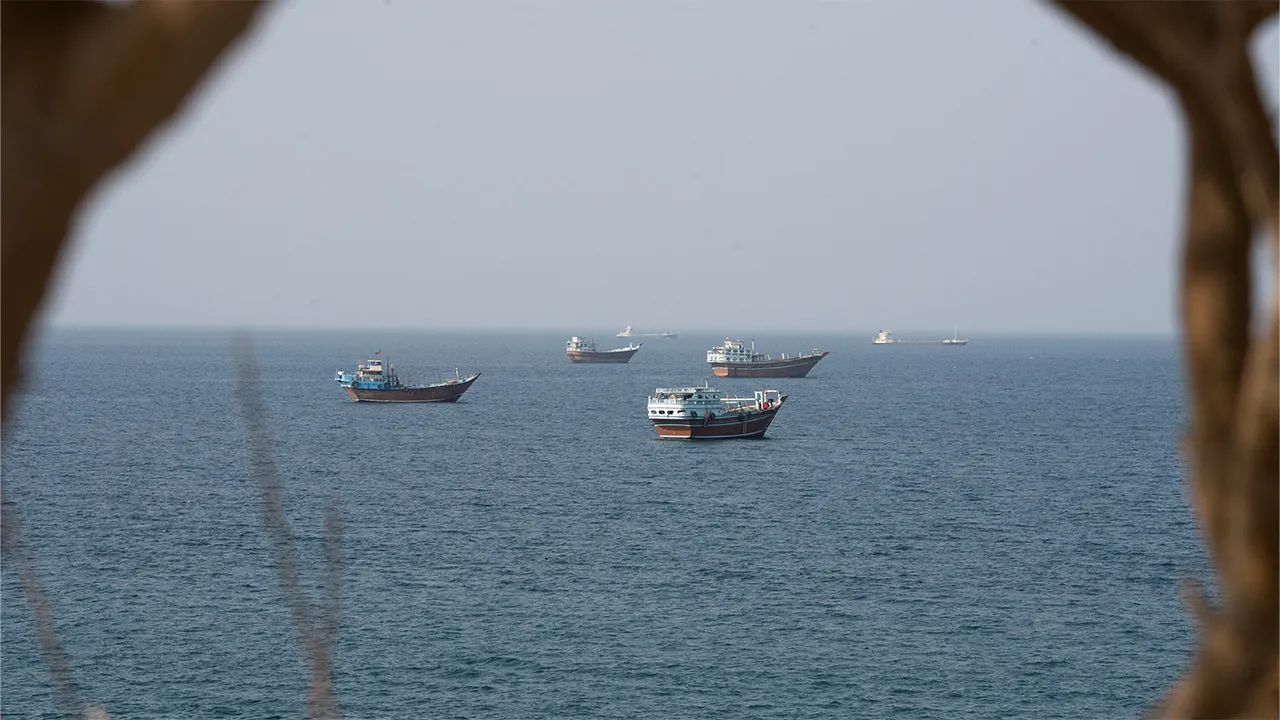 Vessels near the Strait of Hormuz, as seen from Musandam, Oman, August 17, 2026. REUTERS/Stringer