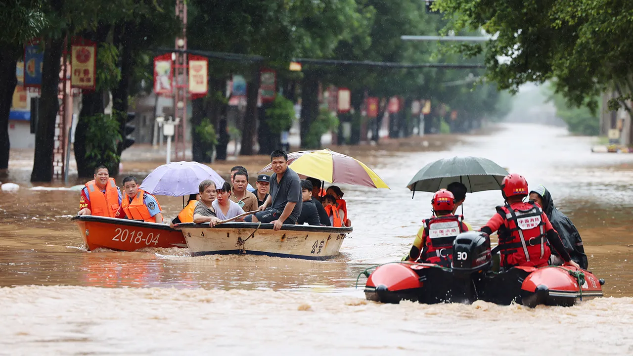 Rescue workers evacuate flood-affected residents by boat after heavy rainfall brought by typhoon Narra caused flooding in Ningming county, Chongzuo, Guangxi Zhuang Autonomous Region, China, August 23, 2026. cnsphoto via REUTERS