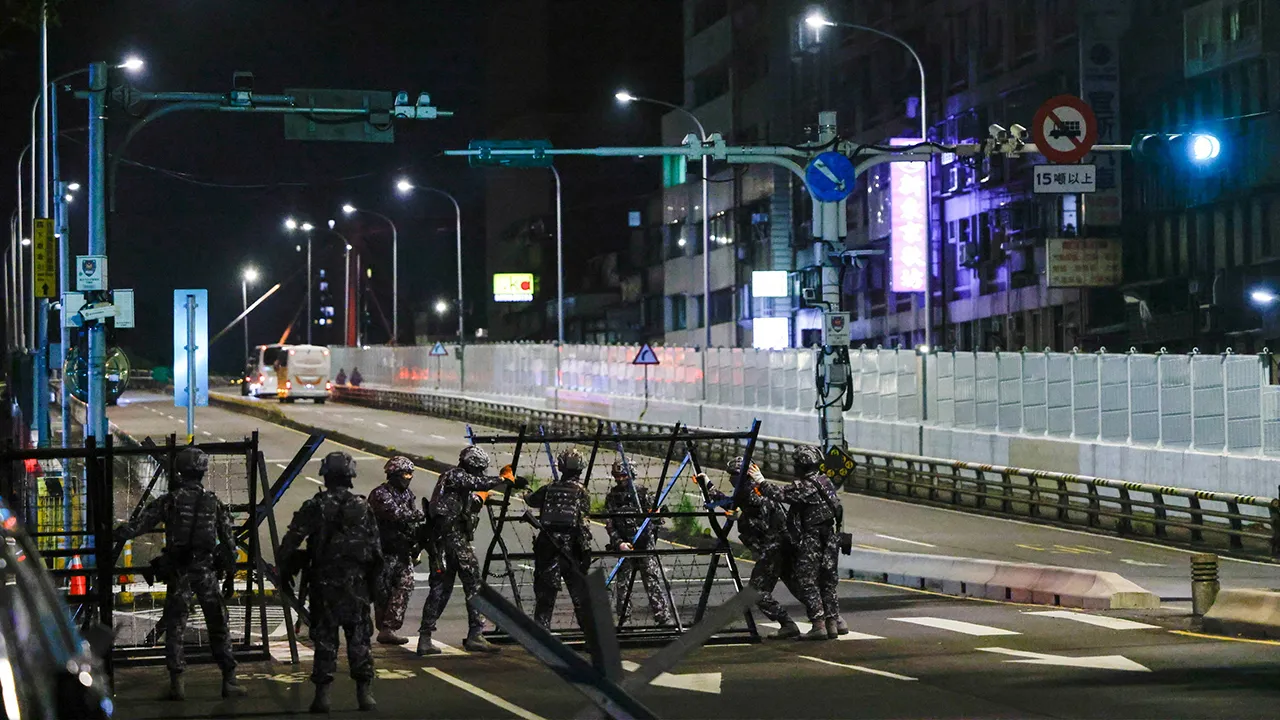 Taiwanese Military Police personnel install road blockades during a drill as part of the annual Han Kuang military exercises in Taipei, Taiwan, August 12, 2026. REUTERS