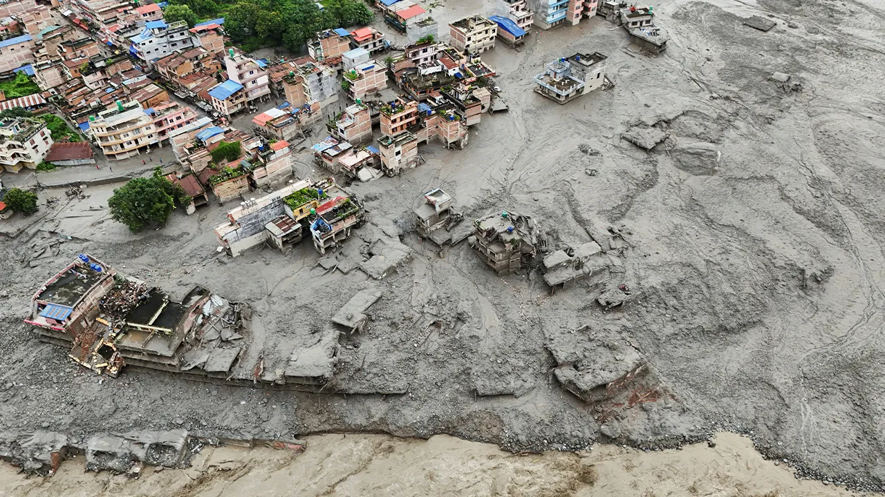 A drone view shows mud covering properties following a flash flood in Trishuli, Nuwakot district, Nepal, August 27, 2026. REUTERS/Navesh Chitrakar