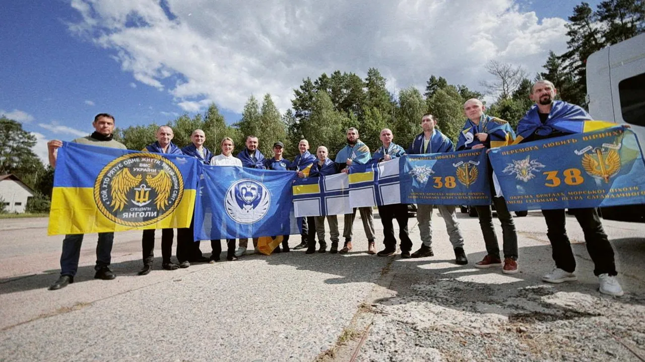 Ukrainian prisoners of war (POWs) pose after a swap, amid Russia's attack on Ukraine, at an unknown location in Ukraine, in this handout picture released August 24, 2026. Ukraine's President Volodymyr Zelenskiy via Telegram/Handout via REUTERS