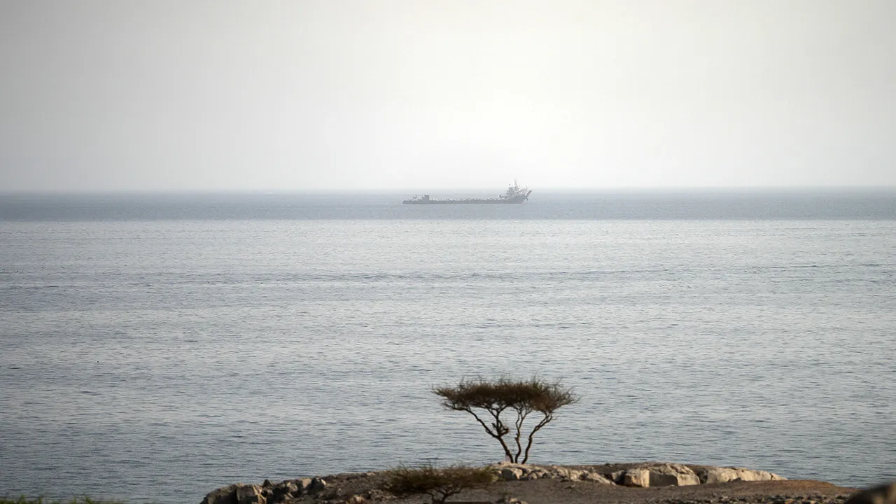 A vessel in the Strait of Hormuz, as seen from Musandam, Oman, August 3, 2026. REUTERS/Stringer