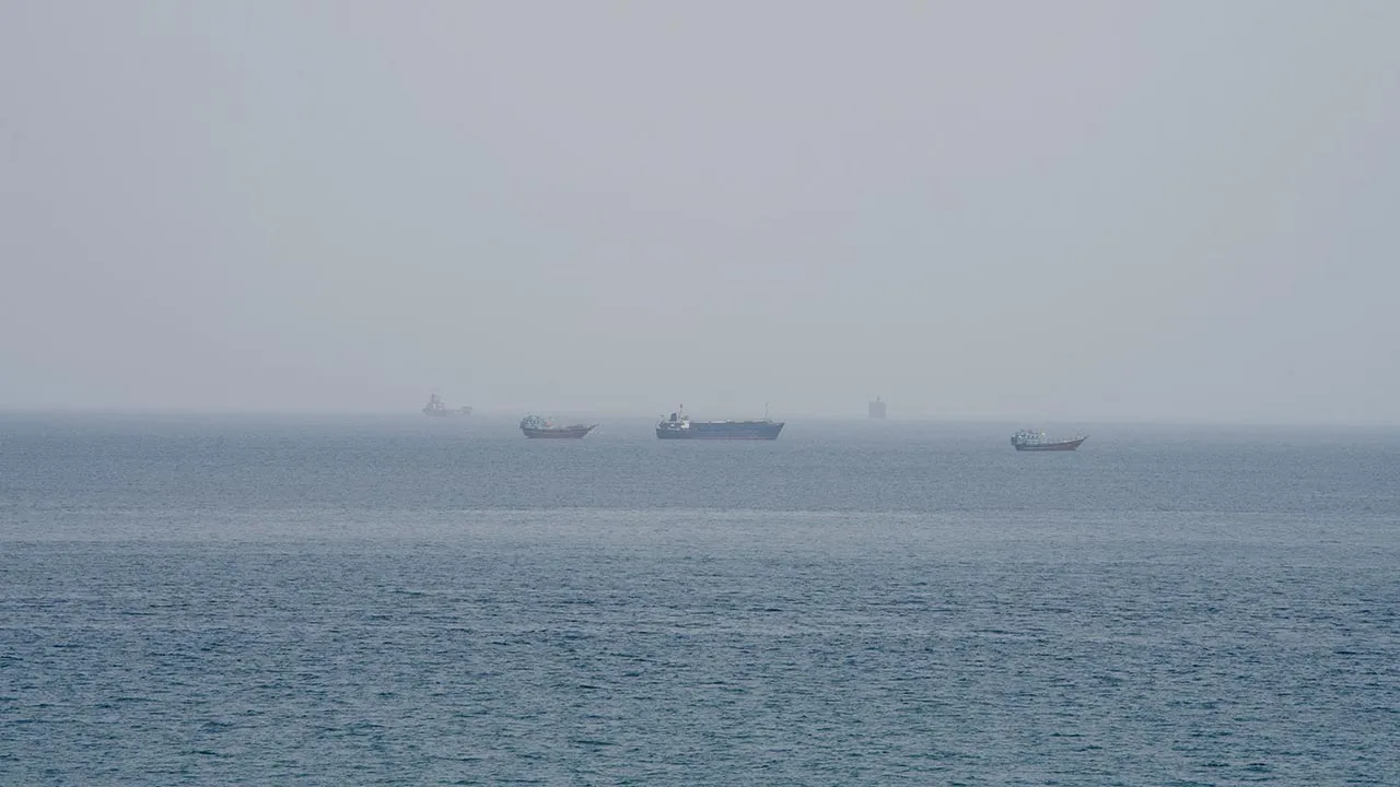 Vessels near the Strait of Hormuz, as seen from Musandam, Oman, August 10, 2026. REUTERS/Stringer