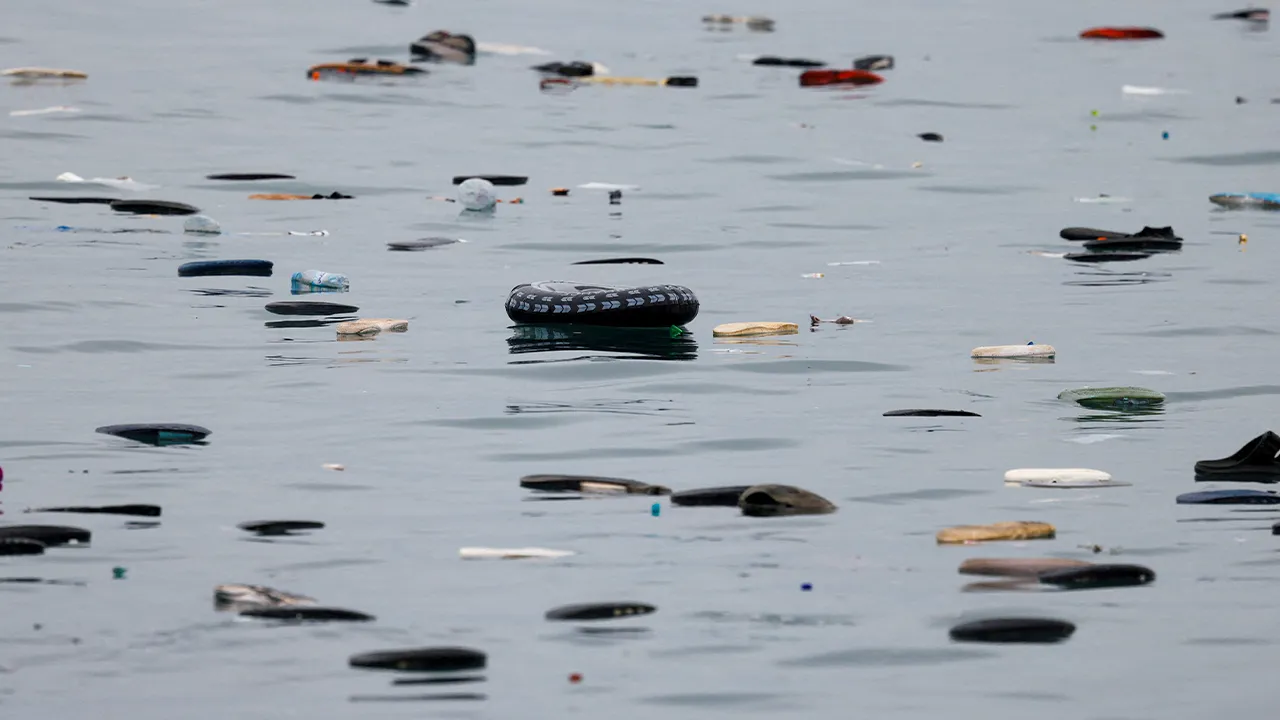 A float and shoes belonging to migrants float in the sea at El Tarajal beach, amid mass crossings of migrants on foot and by sea from Morocco into Spanish territory, in Ceuta, Spain, July 31, 2026. REUTERS/Jon Nazca TPX IMAGES OF THE DAY