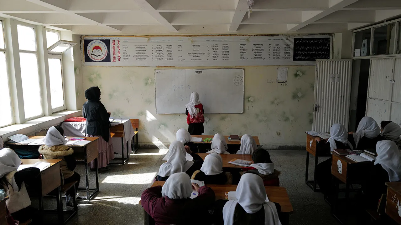 Hadia, 10, a 4th grade primary school student attends a class in Kabul, Afghanistan, October 26, 2021. The hardline Islamist Taliban movement, which stormed to power earlier this year after ousting the Western-backed government, has allowed all boys and younger girls back to class, but has not let girls attend secondary school. "I'm in the 4th grade. I want to be a doctor, but if in two years' time I am not be allowed to continue my studies like my sister, I won't be able to fulfil my dream,_REUTERS