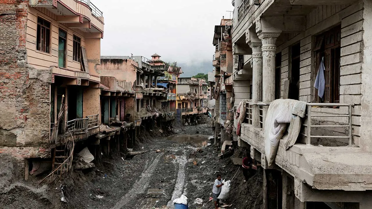 People search for their belongings at a damaged house following deadly flash floods and a mudslide, in Devighat, Nuwakot district, Nepal, September 21, 2026. REUTERS/Navesh Chitrakar TPX IMAGES OF THE DAY